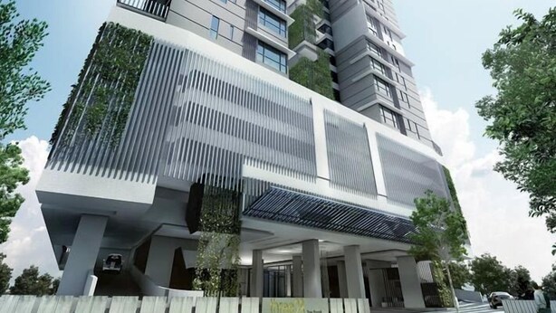 A modern building with a unique facade, featuring vertical gardens and a sloped roof design. - Bochang Homestay (Kuala Lumpur)