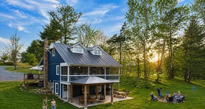 Dreamy riverfront home with sandy beach, hot tub, fire pit, kayaks & fishing