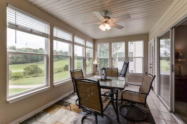 Sunroom with gorgeous views of Thousand Hills golf course.