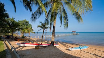 On the beach, sun loungers, beach umbrellas