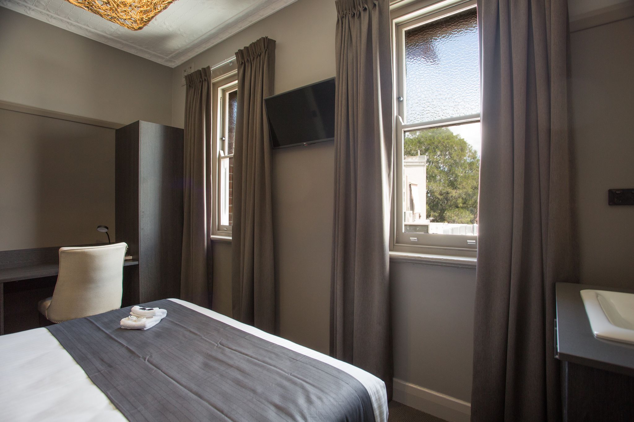 comfort room, 1 queen bed, shared bathroom | premium bedding, iron/ironing board, free wifi, bed sheets