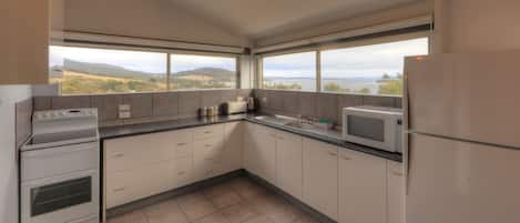 Three Bedroom House | Private kitchen | Fridge, microwave, oven, stovetop