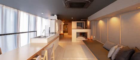 A modern kitchen with a dining area, a built-in seating area, and a small fireplace.