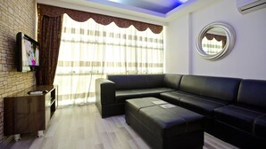 Habitación triple estándar | Zona de estar