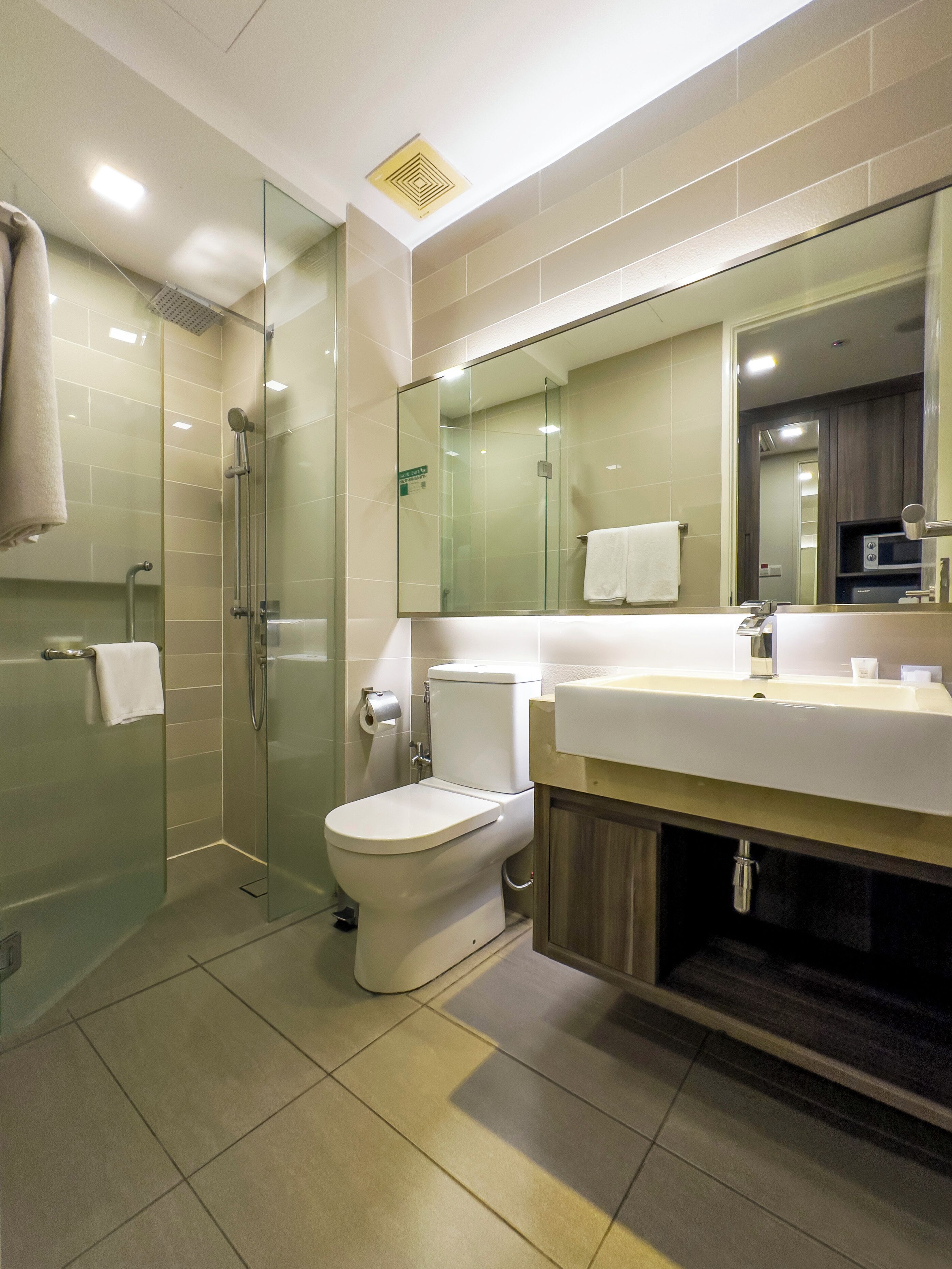 Family Studio (Quadruple) | Bathroom | Shower, rainfall showerhead, free toiletries, hair dryer