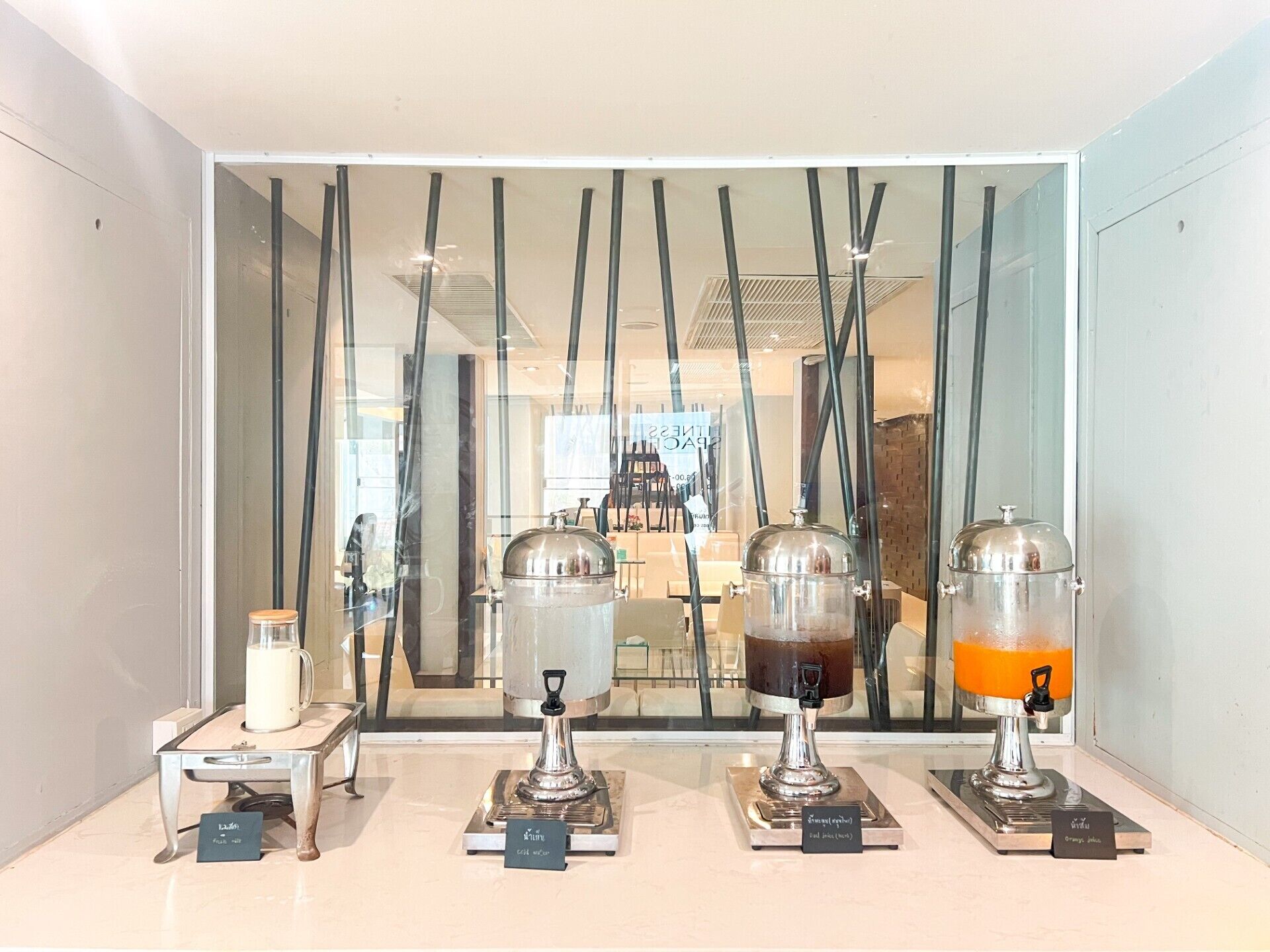 A display of four coffee machines with labels indicating different types of coffee.