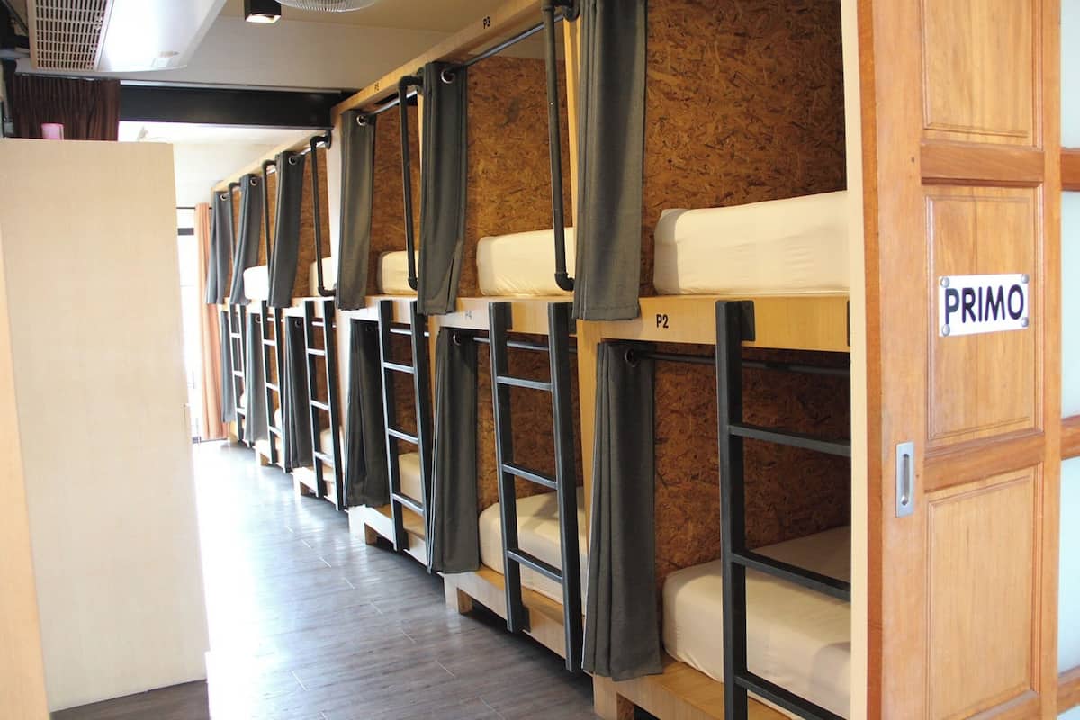 A row of bunk beds with a sign labeled "PRIMO" on the right.