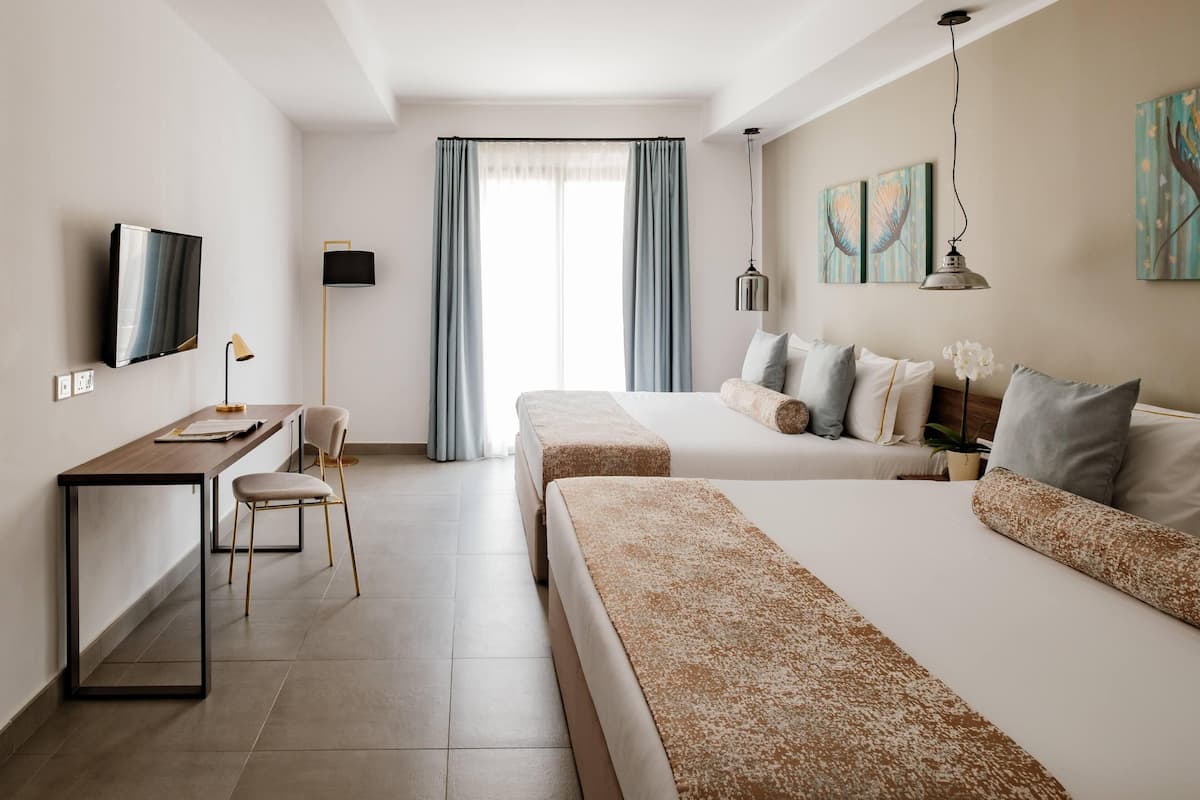 family room | frette italian sheets, premium bedding, pillow-top beds, minibar