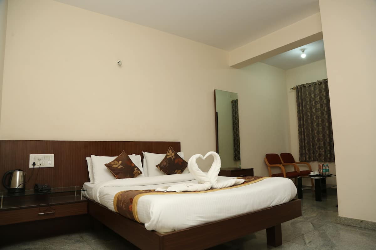 Deluxe Room Non AC | Memory foam beds, desk, laptop workspace, soundproofing