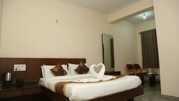 Deluxe Room Non AC | Memory-foam beds, desk, laptop workspace, soundproofing