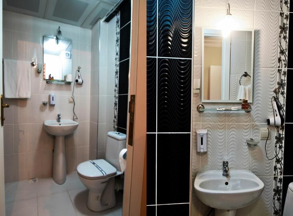 A bathroom with a toilet, sink, and mirror.