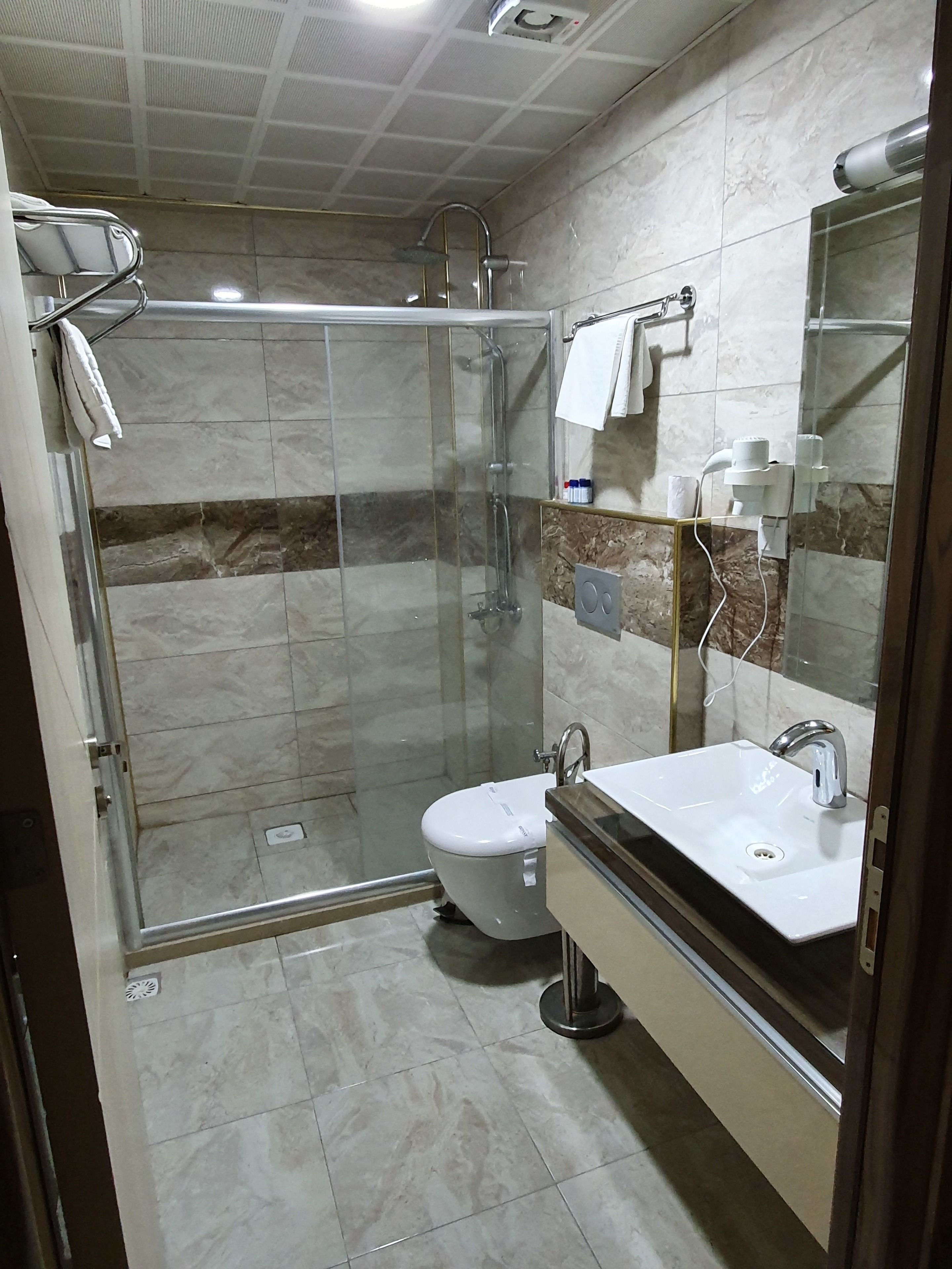 shower, free toiletries, hair dryer, dressing gowns