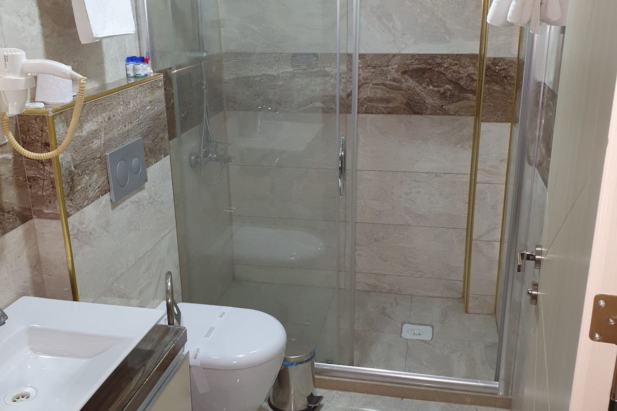 shower, free toiletries, hair dryer, dressing gowns