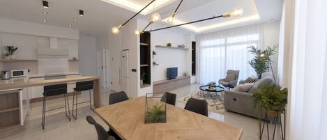 Apartamento superluxo, 2 quartos | Área de estar | TV de tela plana