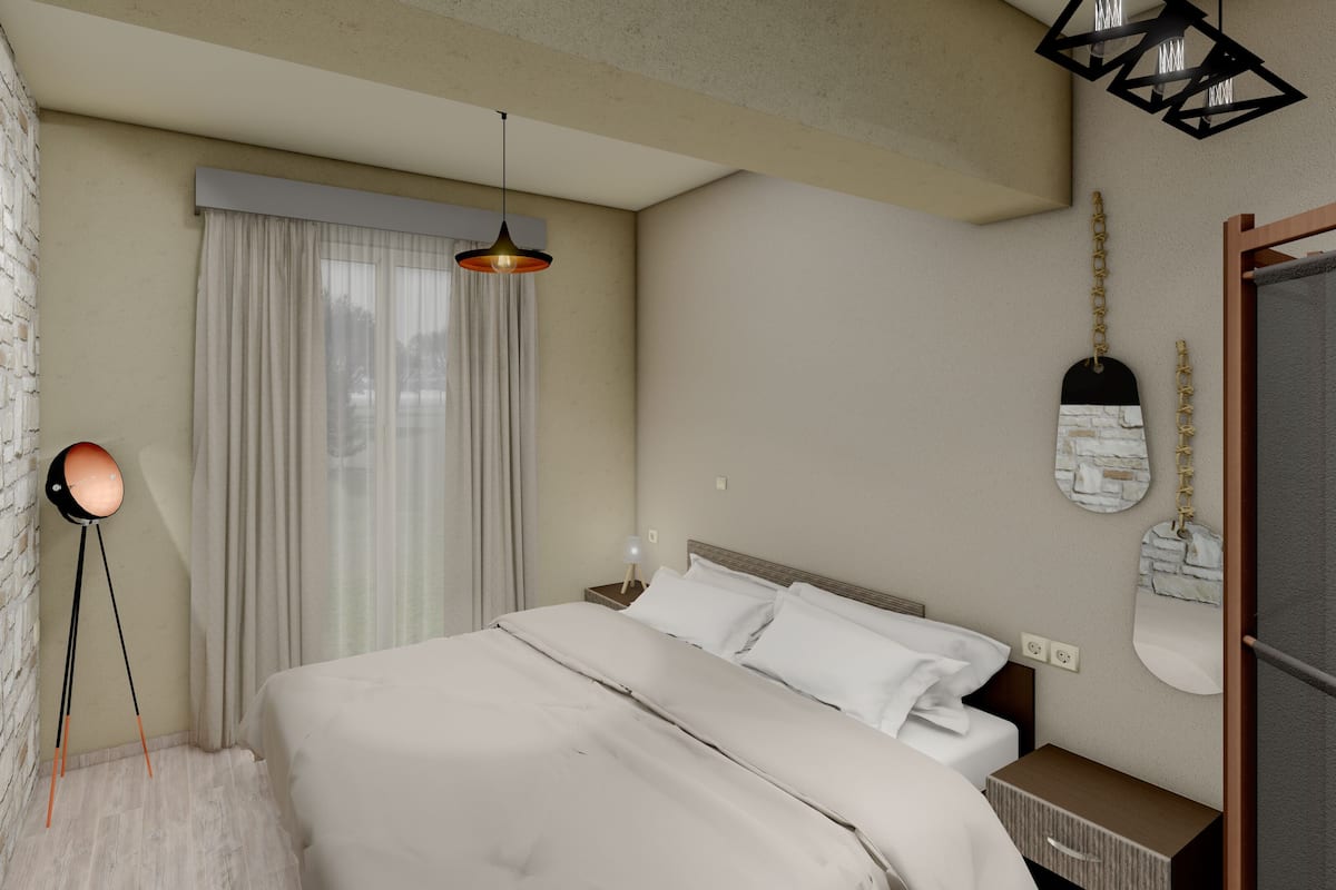 A modern hotel room with a large bed, a standing lamp, a wall-mounted light fixture, and a decorative wall piece.