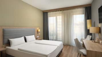 Habitación Deluxe | Caja fuerte, escritorio, cortinas opacas y sistema de insonorización