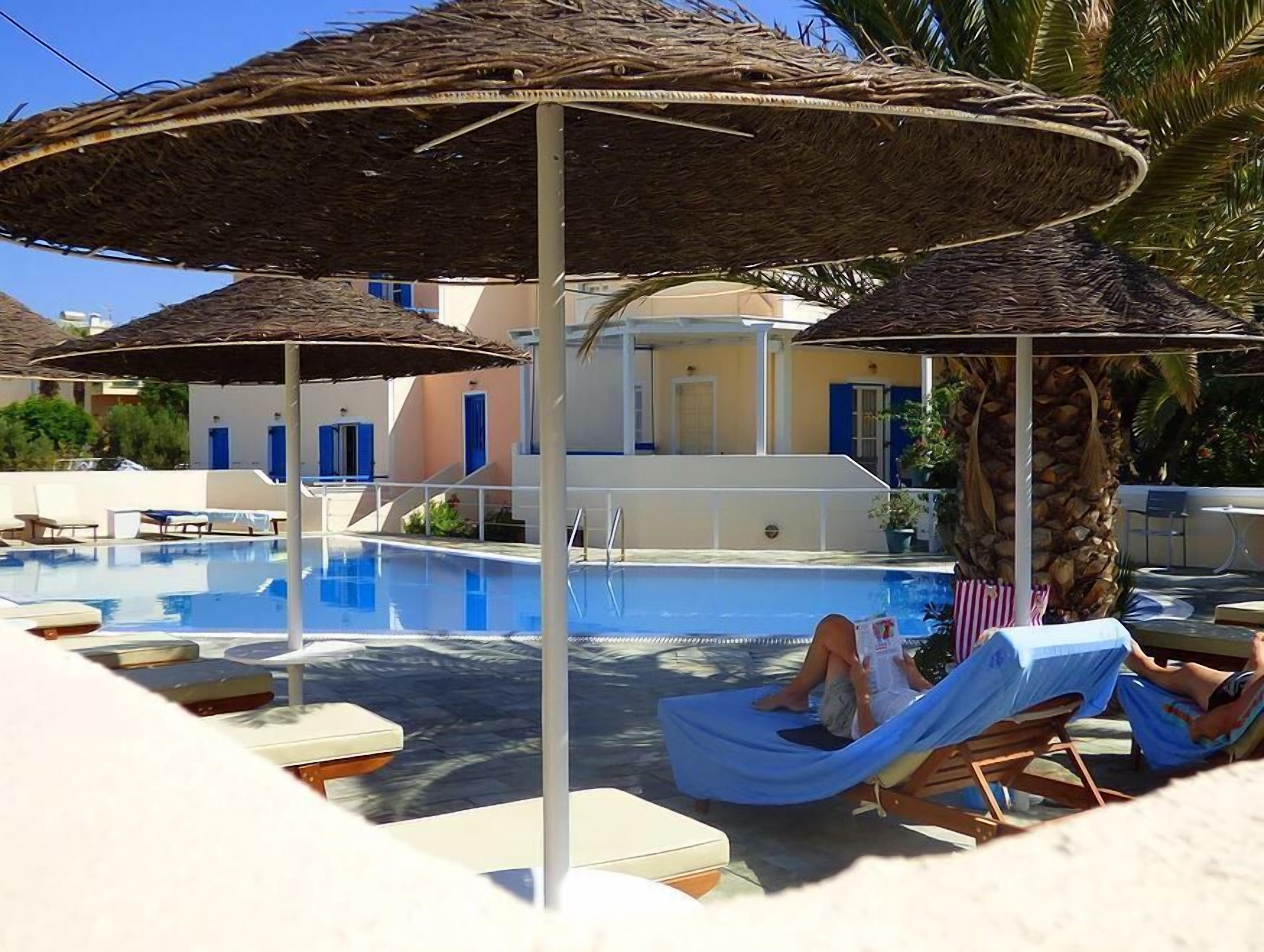 Seasonal outdoor pool, pool umbrellas, pool loungers