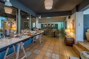 Dine in style with a long counter and comfortable seating for a meal.