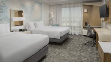 Hypo-allergenic bedding, down duvets, desk, laptop workspace