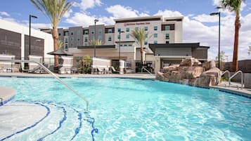 Outdoor pool, open 7 AM to 10 PM, pool umbrellas, pool loungers