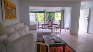 Signature Apartment, Multiple Beds, Pool View, Poolside | Living area | TV - Seawind On The Bay Beach Condo OLR (Montego Bay)