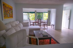 Signature Apartment, Multiple Beds, Pool View, Poolside | Living area | TV - Seawind On The Bay Beach Condo OLR (Montego Bay)