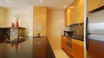 Apartment, 3 Bedrooms (1 Queen + 2 Tri Bunks) | 3 bedrooms, desk, iron/ironing board, cots/infant beds