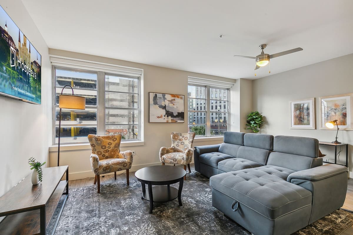 Comfort Condo, 1 Bedroom | Living room | 65-inch flat-screen TV with satellite channels, TV