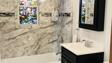 Combined shower/tub, hair dryer, towels, soap