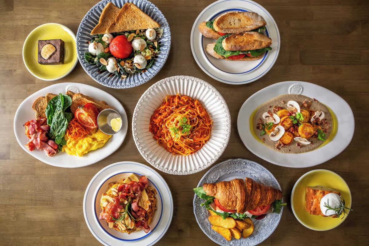 A variety of dishes on a wooden table.