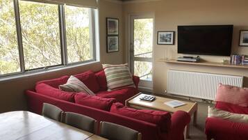 Apartment, 3 Bedrooms | Living area | Flat-screen TV, DVD player