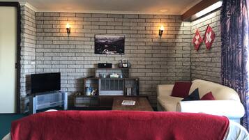 Apartment, 3 Bedrooms | Living area | Flat-screen TV