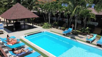 Outdoor pool, open 7:00 AM to 8:00 AM, pool loungers