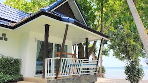 A beachfront property with a covered porch, stone steps, and a view of the sea. - Assava Dive Resort (Koh Tao)