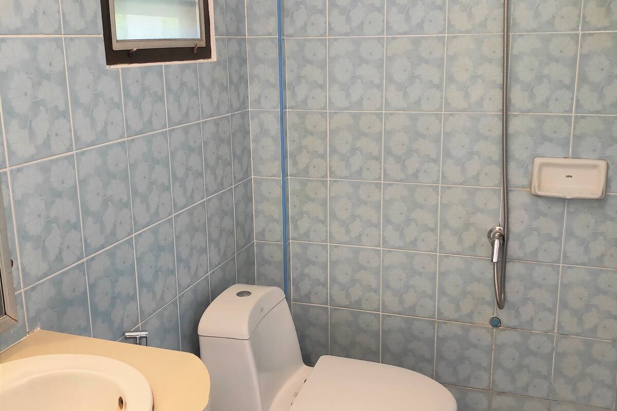 standard room with fan cold shower | bathroom | shower, free toiletries, bidet, towels