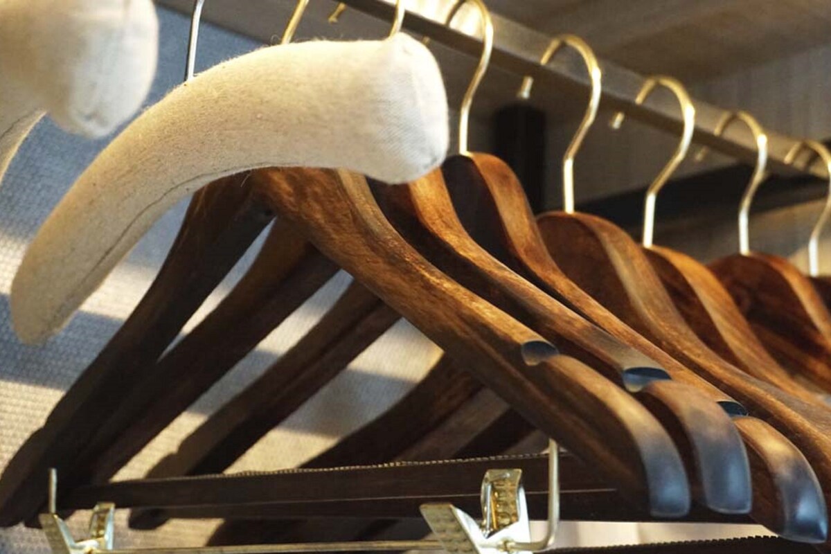 A rack of wooden hangers.