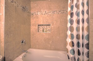 Combined shower/tub, hair dryer, towels, soap
