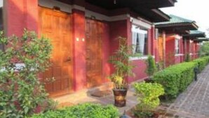 A traditional building with wooden doors and a tiled roof. - Pyi1 Guest House (Nyaungshwe)