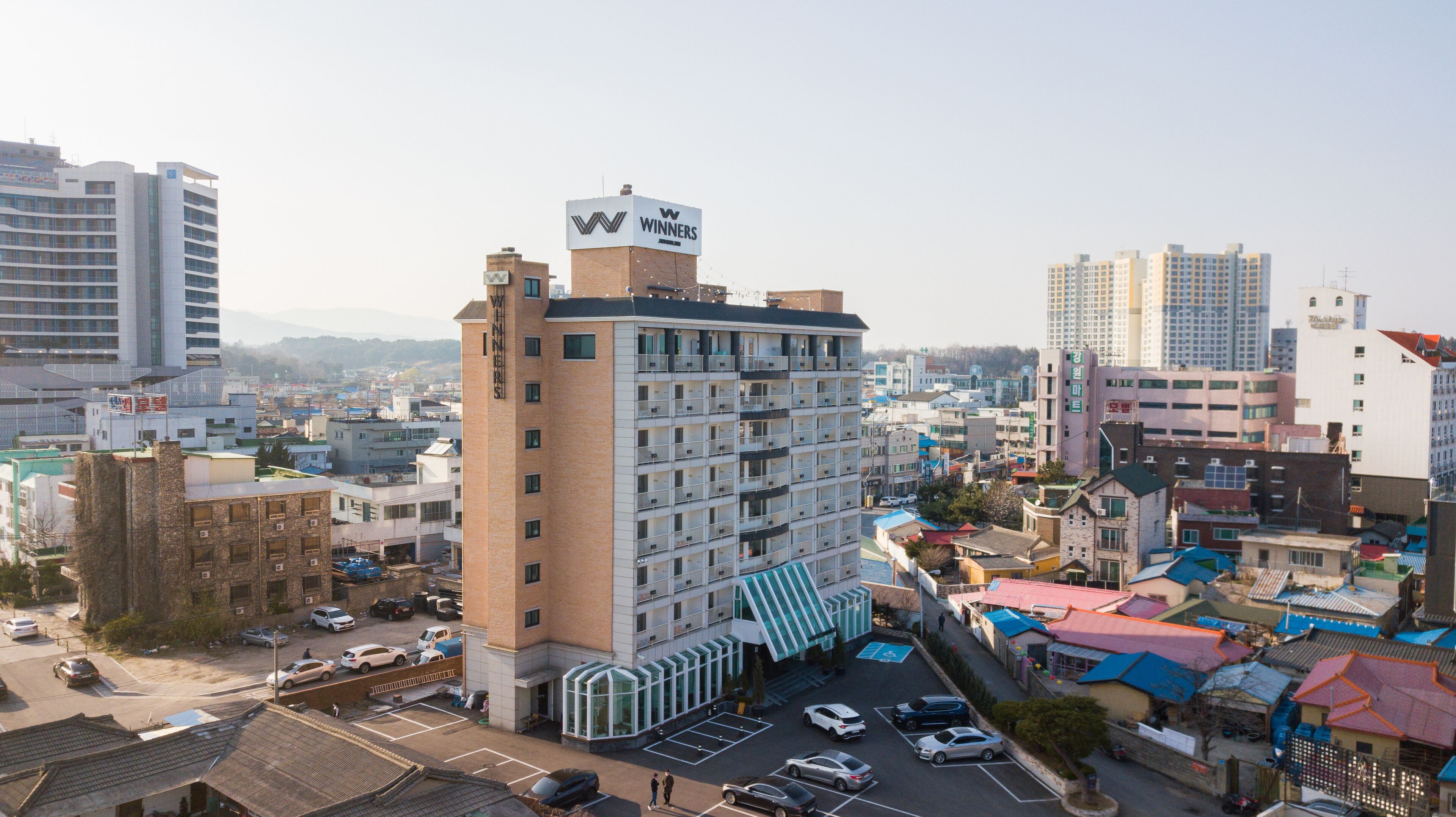 A multi-story hotel with a prominent 'Winners' sign on the top.