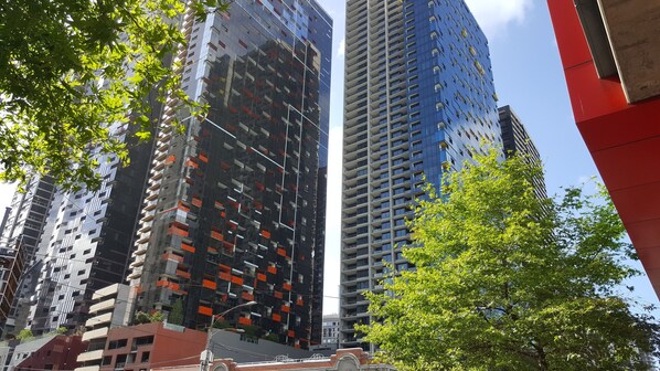 A high-rise building with multiple floors, large windows, and balconies. - C3CBD Melbourne Apartment (Melbourne)
