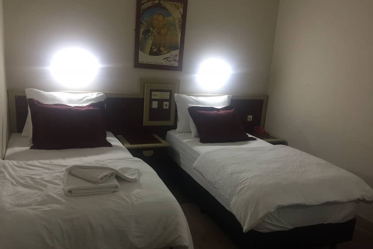 Quarto solteiro | Roupas de cama premium, Wi-Fi de cortesia