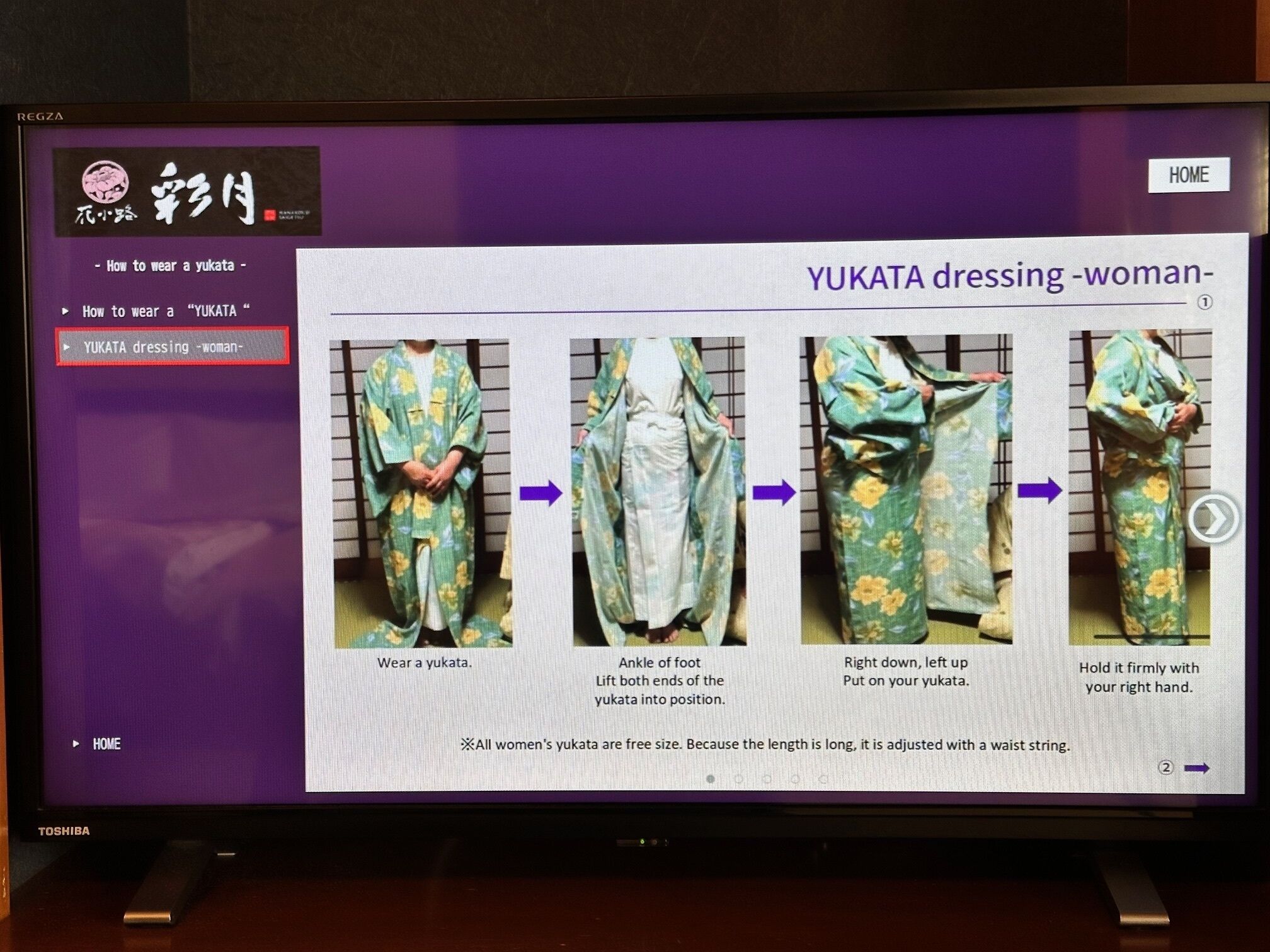 A television screen displaying a tutorial on how to wear a yukata, a traditional Japanese garment.