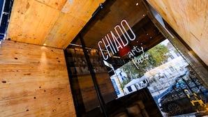 A wooden interior with a sign reading "CHIADO Art & Craft". - Chiado Arty flats (Lisbon)