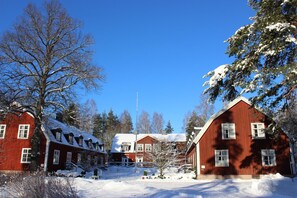 Set amidst a serene winter landscape, this charming hotel offers a warm and inviting atmosphere.