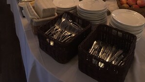 A buffet setup with various food items, plates, and utensils. - Sätra Brunn Hälsobrunn (Sala)