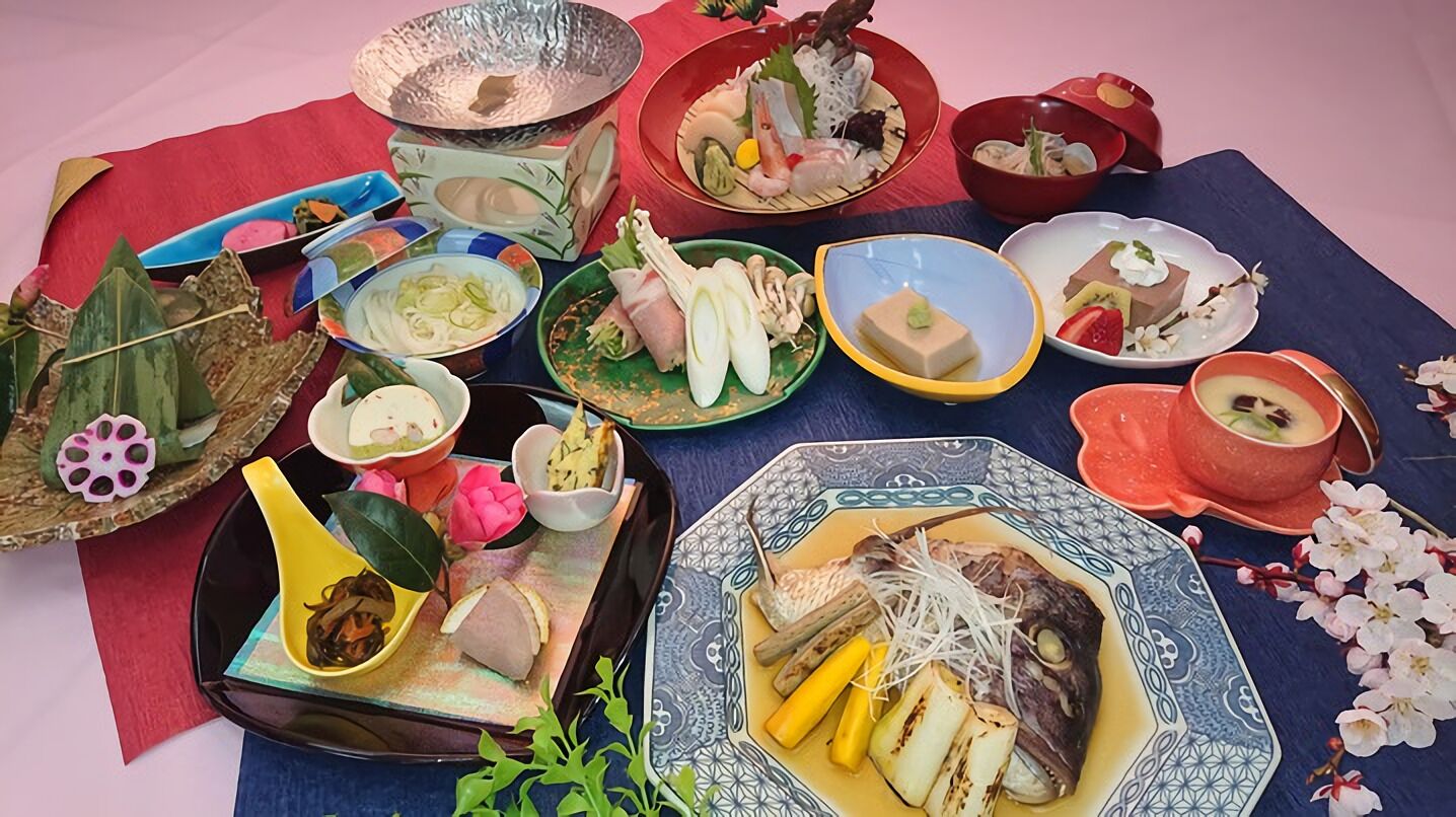 A variety of dishes and bowls arranged on a table, suggesting a meal setting.