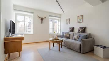Deluxe suite (Bergjuwel) | Woonkamer | Een flatscreentelevisie