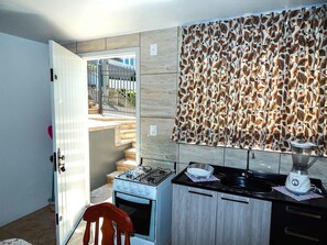 Comfort Apartment, 1 Bedroom | Private kitchen | Fridge, microwave, oven, stovetop