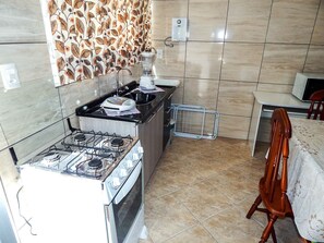 Comfort Apartment, 1 Bedroom | Private kitchen | Fridge, microwave, oven, stovetop