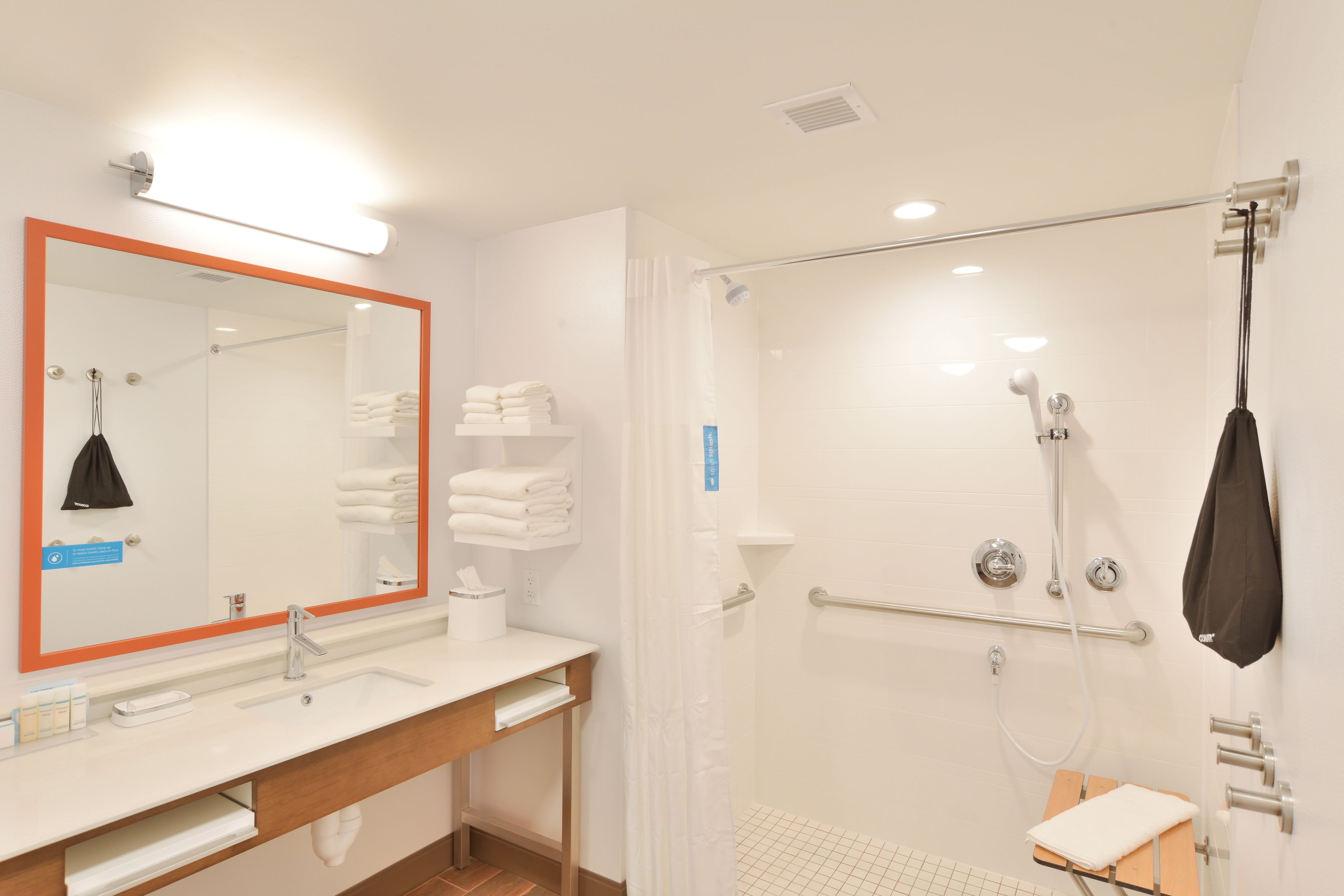 studio, 1 king bed, accessible (roll-in shower) | bathroom | combined shower/bathtub, designer toiletries, towels